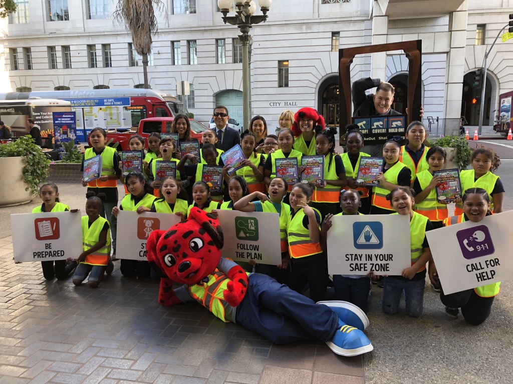 Great ShakeOut earthquake drill Officials and Holmes Avenue Elementary students pose with Rocket in front of City Hall before the Great ShakeOut earthquake drill.