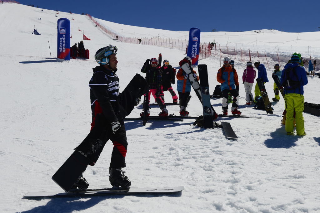 SNOWBOARD-WORLD-PGS-MEN-FINALS Riders wait on the finish line of the World Cup Parallel Giant Slalom race at the World Cup Super finals Snowboard and FreeStyle at Sierra Nevada ski resort near Granada March 20, 2013. The World Cup Parallel Giant Slalom race was cancelled due to bad snow conditions.