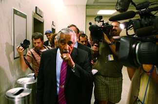 Followed by members of the press, U.S. Rep. Charles Rangel (D-NY) (L) leaves his office for a vote at the Capitol July 28, 2010 in Washington, DC.