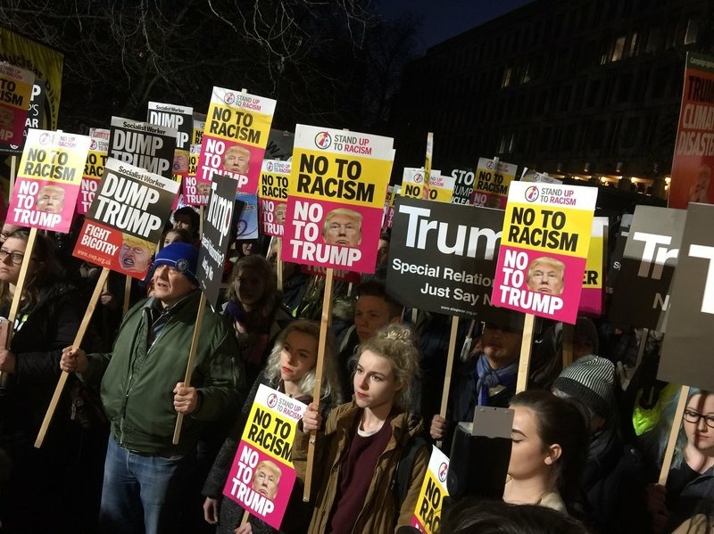 Protesters gathered outside the U.S. Embassy in London on Friday evening. Protesters gathered outside the U.S. Embassy in London on Friday evening.
