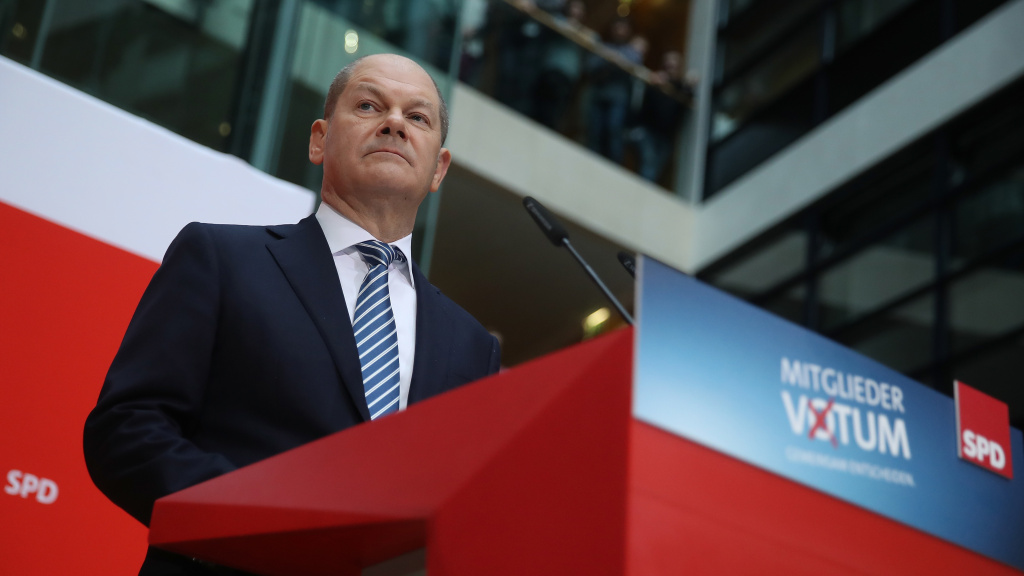 Acting chairman of the Social Democrats (SPD) Olaf Scholz announced that party members backed forming a new coalition government with Angela Merkel's Christian Democrats. Acting chairman of the Social Democrats (SPD) Olaf Scholz announced that party members backed forming a new coalition government with Angela Merkel's Christian Democrats.