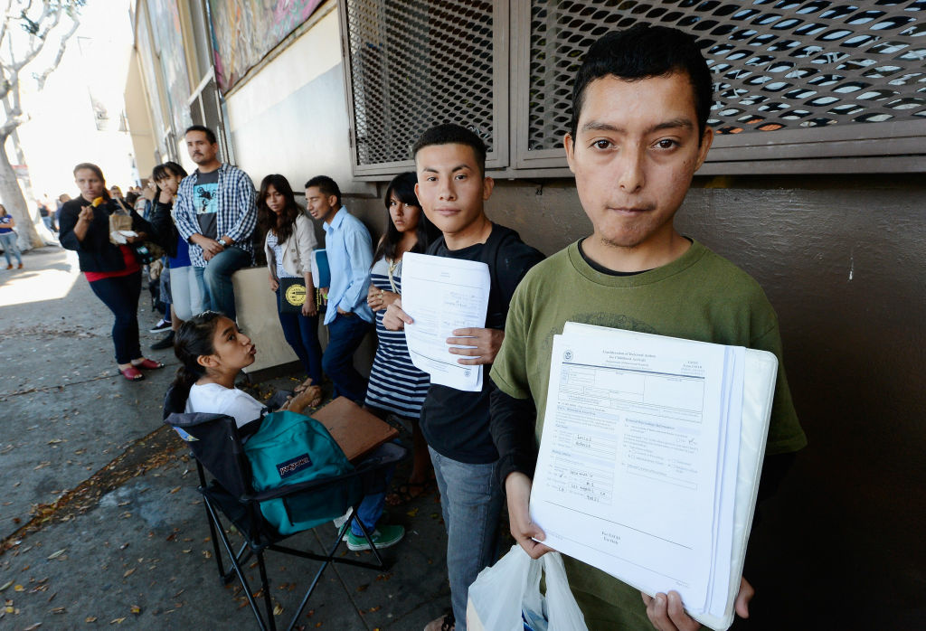 Young Immigrants Apply For Obama Administration's Temporary Deportation Reprieve Roberto Larios, 21, (R) holds Deferred Action for Childhood Arrival application as he waits in line with hundreds of fellow undocumanted immigrants at the Coalition for Humane Immigrant Rights of Los Angeles offices to apply for deportation reprieve on August 15, 2012 in Los Angeles, California. Under a new program established by the Obama administration undocumented youth who qualify for the program, called Deferred Action for Childhood Arrivals, can file applications from the U.S. Citizenship and Immigration Services website to avoid deportation and obtain the right to work.