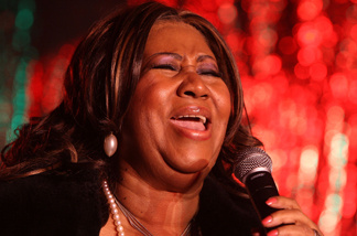 Singer Aretha Franklin performs at the 85th annual New York Stock Exchange Christmas tree lighting festivities on Wall Street December 4, 2008 in New York City.