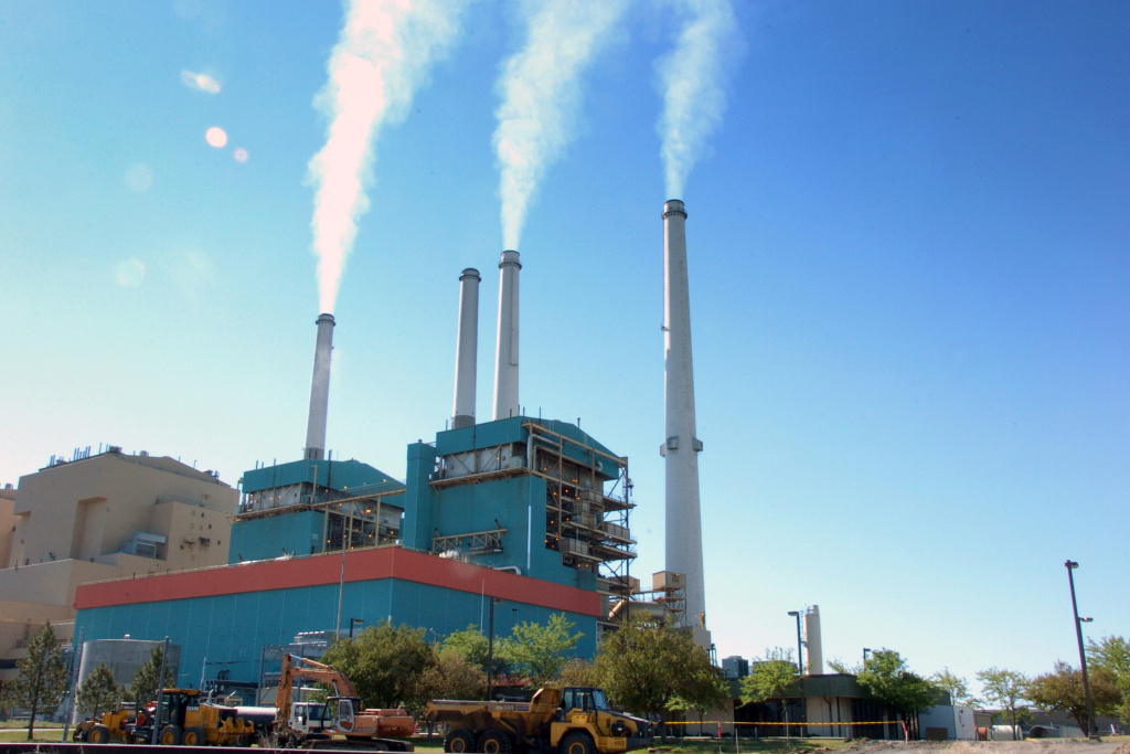 Climate Change-Montana FILE - In this July 1, 2013, file photo, smoke rises from the Colstrip Steam Electric Station, a coal burning power plant in in Colstrip, Mont. State officials planned a public meeting Tuesday, Sept. 30, 2014, in Colstrip on the U.S. Environmental Protection Agency proposal to cut greenhouse emissions. The town is home to one of the largest coal-fired power plants in the West, a 2,100-megawatt facility that churns out more greenhouse gases than any other source in Montana. (AP Photo/Matthew Brown, File)