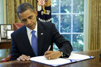 U.S. President Barack Obama signs an extension of unemployment benefits at the White House on July 22, 2010 in Washington, D.C. Earlier today the President signed the Improper Payments Elimination and Recovery Act that will require federal agencies to put forth more funds towards audits to curb improper spending.