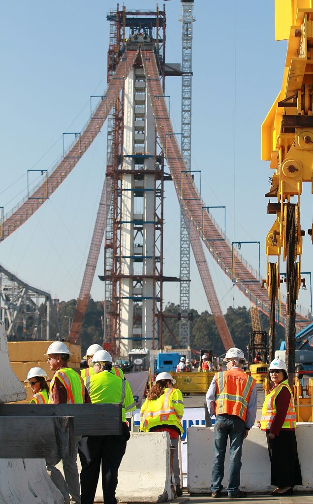 Engineers say the new span of the San Francisco-Oakland Bay Bridge would be able to handle a large earthquake much better than its aging counterpart. (Photo: Oakland mayor Jean Quan (R) tours a construction site at the final deck section of new self-anchored suspension span of the Bay Bridge on October 28, 2011 in Oakland, California. By Justin Sullivan/Getty Images)