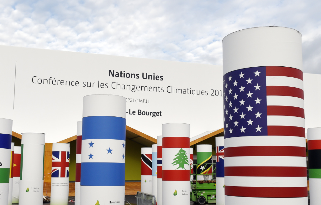 Pillars with the names and national flags of countries attending the COP 21, UN climate conference, decorate the outside of the venue hall, on November 25, 2015, in Le Bourget, north of Paris.