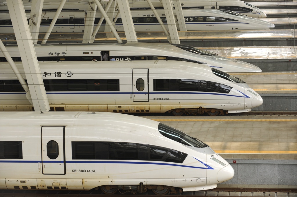 File: A picture taken on August 11, 2011 show two CRH380BL bullet trains (bottom) sitting at Beijing south railway station.
