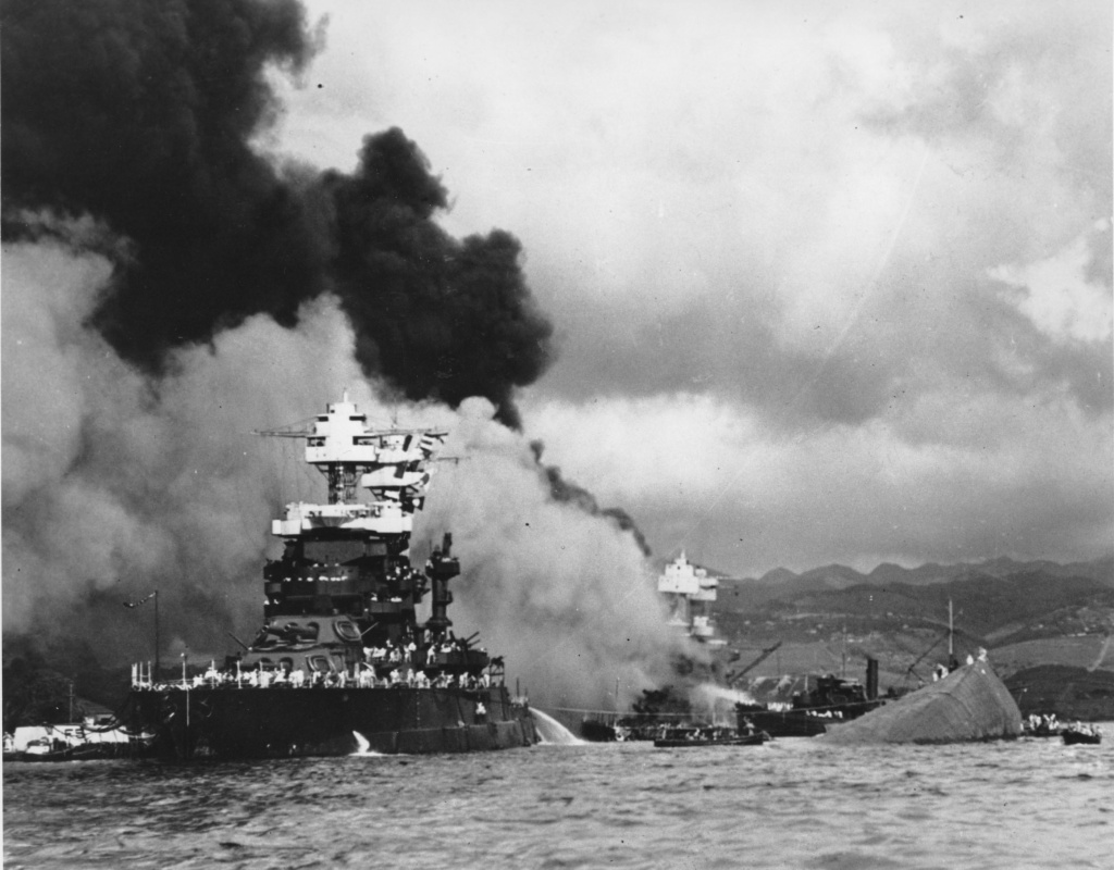 File: in this Dec. 7, 1941 file photo, the battleship USS West Virginia, center, begins to sink after suffering heavy damage, while the USS Maryland, left, is still afloat in Pearl Harbor, Oahu, Hawaii. The capsized USS Oklahoma is at right. File: in this Dec. 7, 1941 file photo, the battleship USS West Virginia, center, begins to sink after suffering heavy damage, while the USS Maryland, left, is still afloat in Pearl Harbor, Oahu, Hawaii. The capsized USS Oklahoma is at right.