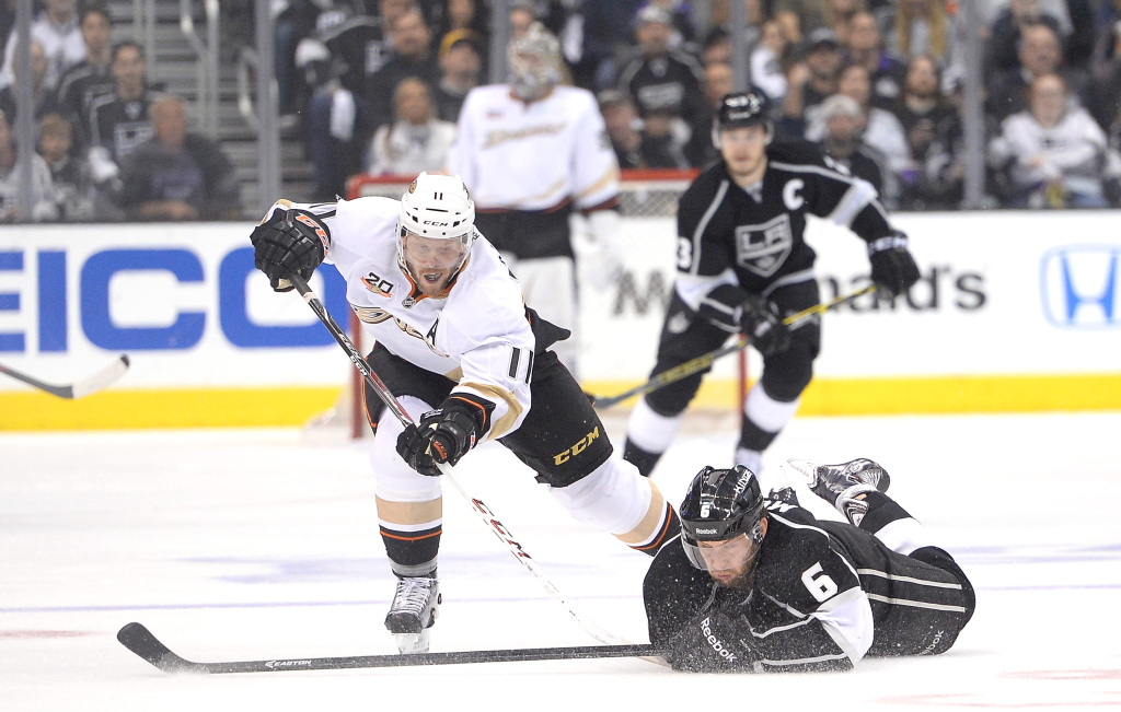 Anaheim Ducks v Los Angeles Kings - Game Four Saku Koivu #11 of the Anaheim Ducks chases after the puck as Jake Muzzin #6 of the Los Angeles Kings dvies during the first period in Game Four of the Second Round of the 2014 NHL Stanley Cup Playoffs at Staples Center on May 10, 2014 in Los Angeles, California.