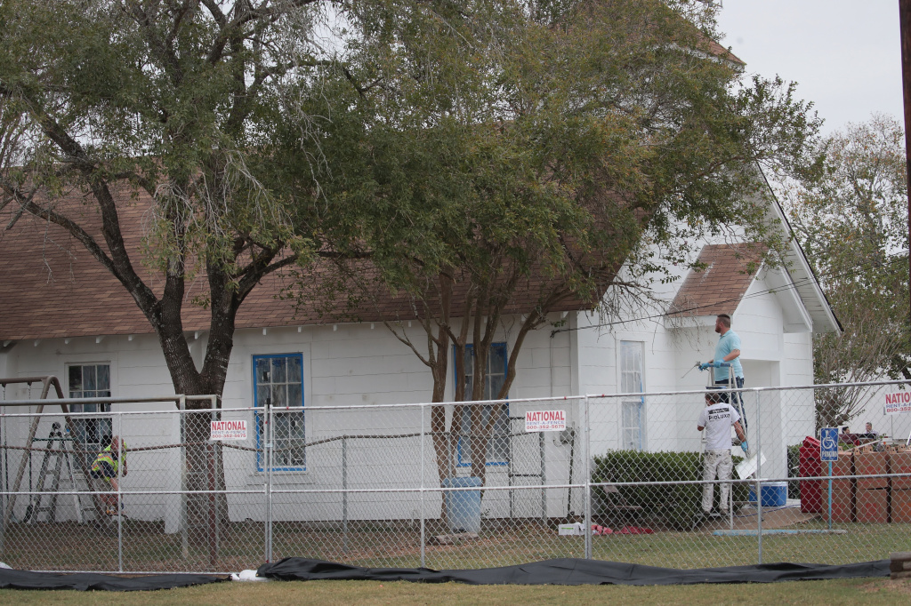 Workers patch bullet holes and paint the exterior of the First Baptist Church in Sutherland Springs, Texas, on Thursday after a gunman opened fire Sunday, killing 26 people and wounding 20 others. Workers patch bullet holes and paint the exterior of the First Baptist Church in Sutherland Springs, Texas, on Thursday after a gunman opened fire on Nov. 5, 2017, killing 26 people and wounding 20 others.