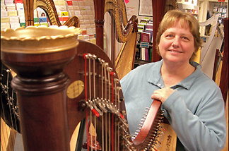 Mercer 7558 Sylvia Woods with her harp.