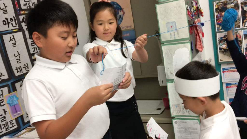 Korean Dual Language Students in the Korean dual language program at Cahuenga Elementary in Los Angeles' Koreatown neighborhood walk through a role-playing exercise on Weds., May 30, 2018.