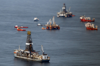 Ships assist in clean up and containment near the source of the BP Deepwater Horizon oil spill July 27, 2010 in the Gulf of Mexico off the coast of Louisiana.