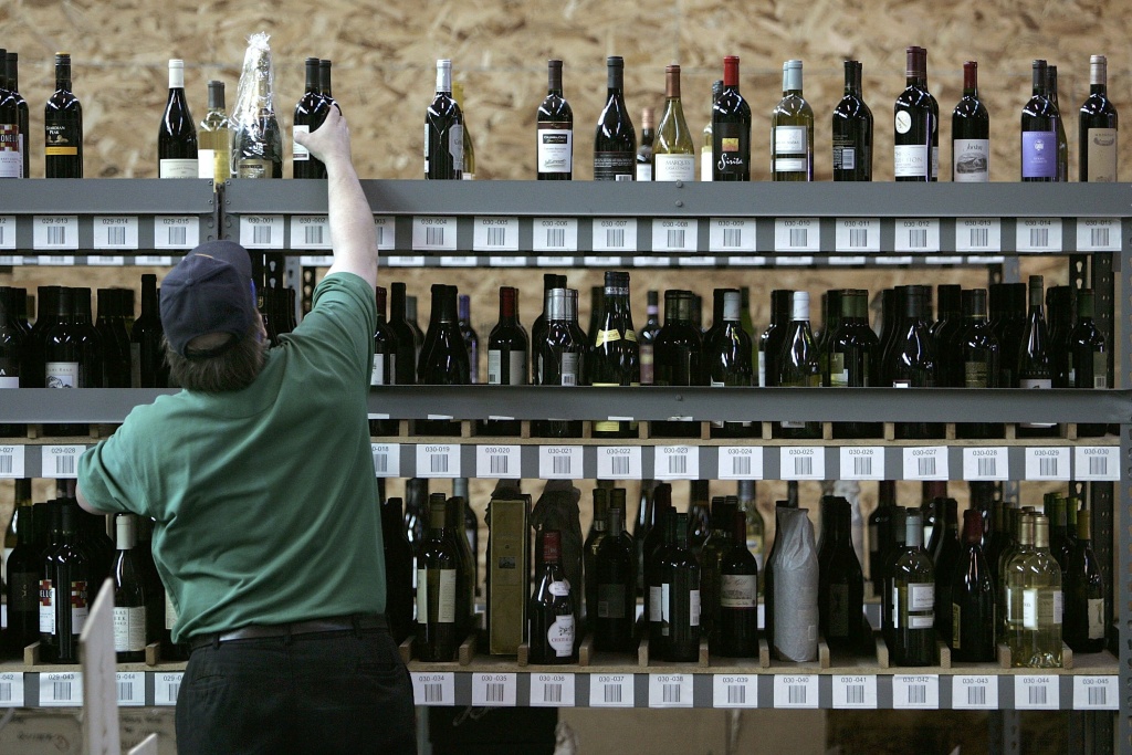 California Wine Sales Hit A New Record In 2005 Wine.com worker Allen Bohnert stocks shelves with bottles of wine at the wine.com warehouse in Oakland, Califorina.