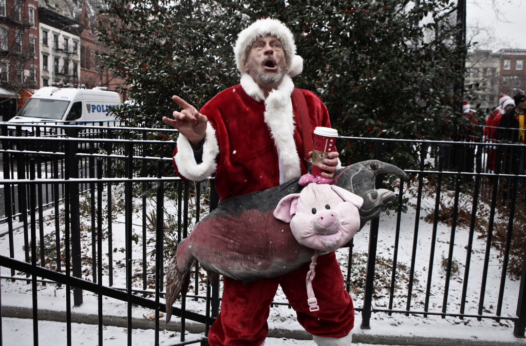 Revelers Dressed As Santa Take Part In Annual Bar Crawl Thru NYC A drunk reveler dressed as Santa Claus sings at Tompkins Square Park as he takes part in the annual SantaCon bar crawl event on December 14, 2013 in New York City.