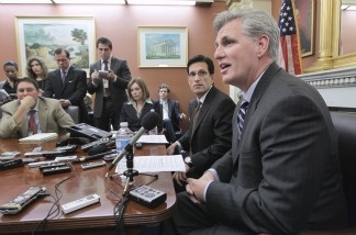House Majority Leader Eric Cantor of Va. (left) and House Majority Whip Kevin McCarthy of Calif. (right) meet reporters on Capitol Hill in Washington, D.C., on March 14, 2011, as Congress resumes work on another contentious short-term spending bill to keep the government running.