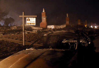 Fires burn where remains of homes and automobiles consumed by a massive fire in a residential neighborhood are scattered on September 9, 2010 in San Bruno, California. A huge explosion rocked a neighborhood near San Francisco International Airport.