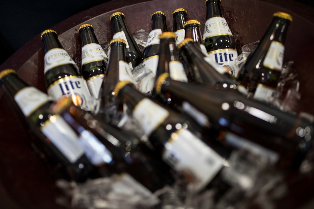 US-YEAR2017-HARASSMENT Miller Lite beer bottles sit on ice at a holiday party on December 14, 2017 in Trevose, Pennsylvania.