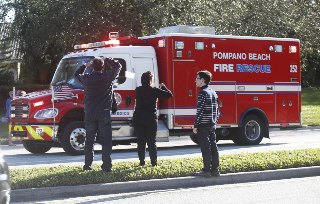 School Shooting Florida Anxious family members watch a rescue vehicle pass by, Wednesday, Feb. 14, 2018, in Parkland, Fla. A shooting at Marjory Stoneman Douglas High School school sent students rushing into the streets as SWAT team members swarmed in and locked down the building.
