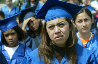 File photo: Nelly Rodriguez (foreground), a student at Wichita High School in Wichita, Kansas, and originally from Mexico, participates in a mock graduation ceremony at the West Front of the U.S. Capitol April 20, 2004 in Washington, DC.