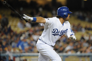 Andre Ethier #16 of the Los Angeles Dodgers hits a RBI single in the second inning against the Atlanta Braves at Dodger Stadium on April 20, 2011 in Los Angeles, California.