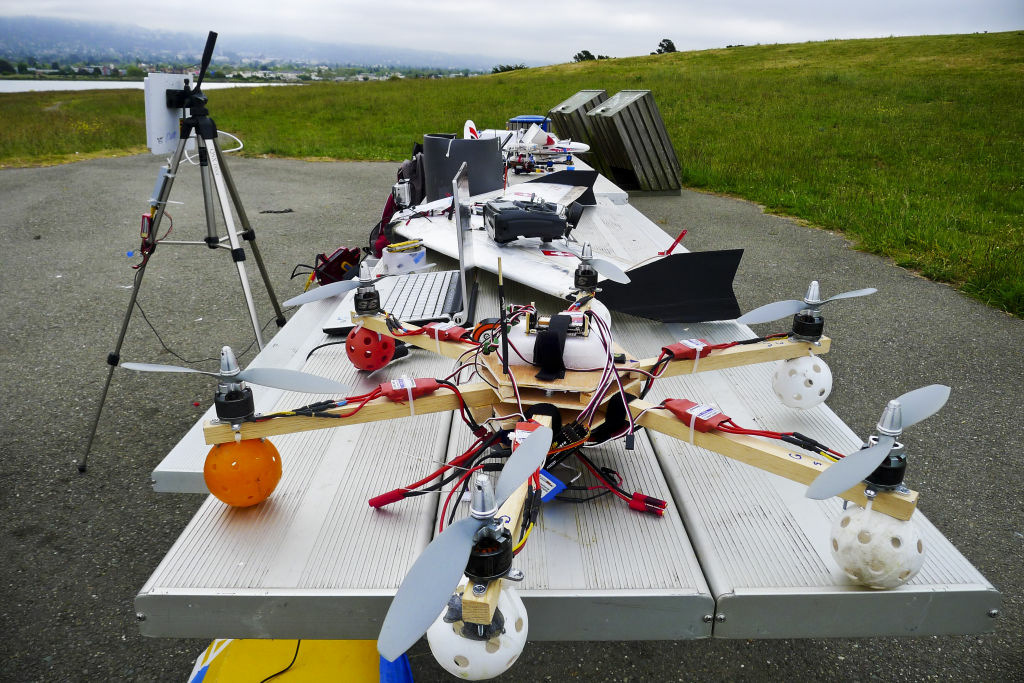 Researchers at the University of California, Davis are testing the use of small unmanned helicopters for pesticide spraying at farms and vineyards. (Photo: Hi-tech hobbyists Andreas Oesterer and Mark Harrison line up their homemade drones in Berkeley, Calif.) Researchers at the University of California, Davis are testing the use of small unmanned helicopters for pesticide spraying at farms and vineyards. (Photo: Hi-tech hobbyists Andreas Oesterer and Mark Harrison line up their homemade drones in Berkeley, Calif.)