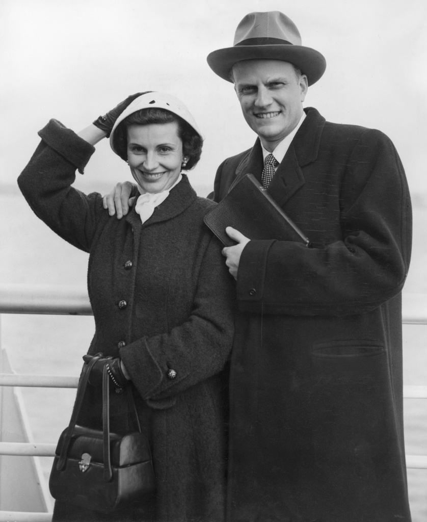 Billy Graham, the American evangelist, and his wif Billy Graham, the American evangelist, and his wife Ruth, pose aboard the liner