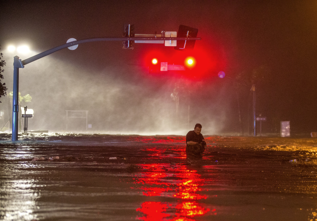 Hurricane Nate Slams Into U.S. Gulf Coast Lanny Dean, from Tulsa, Oklahoma, wades through water on flooded Beach Blvd. in Biloxi, Mississippi as the eye of Hurricane Nate pushes ashore on Sunday, October 8, 2017.