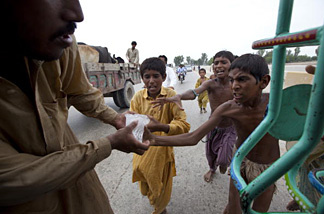Desperate flood victims scramble for some ice donated by a local Muslim organization on August 15, 2010 in Sukkur , Pakistan. The country's agricultural heartland has been devastated as rice, corn and wheat crops have been destroyed by the floods, officials say as many as 20 million people have been effected. Pakistan is suffering from the worst flooding in 80 years as the army and aid organizations struggle to cope with the scope of the wide spread scale of the disaster which has killed over 1,600 people and displaced millions. The U.N. has described the disaster as unprecedented with over a third of the country under water.