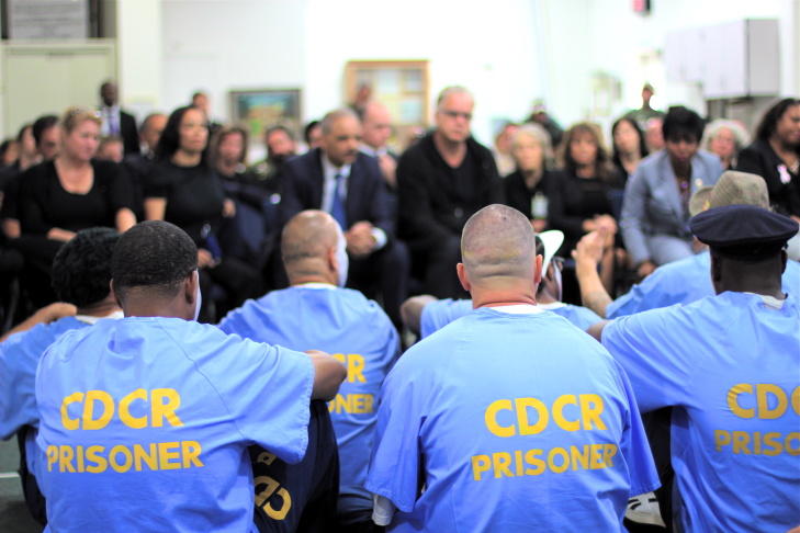 Attorney General Eric Holder watches a performance of the Actor's Gang Prison Project at the California Rehabilitation Center in Norco, California