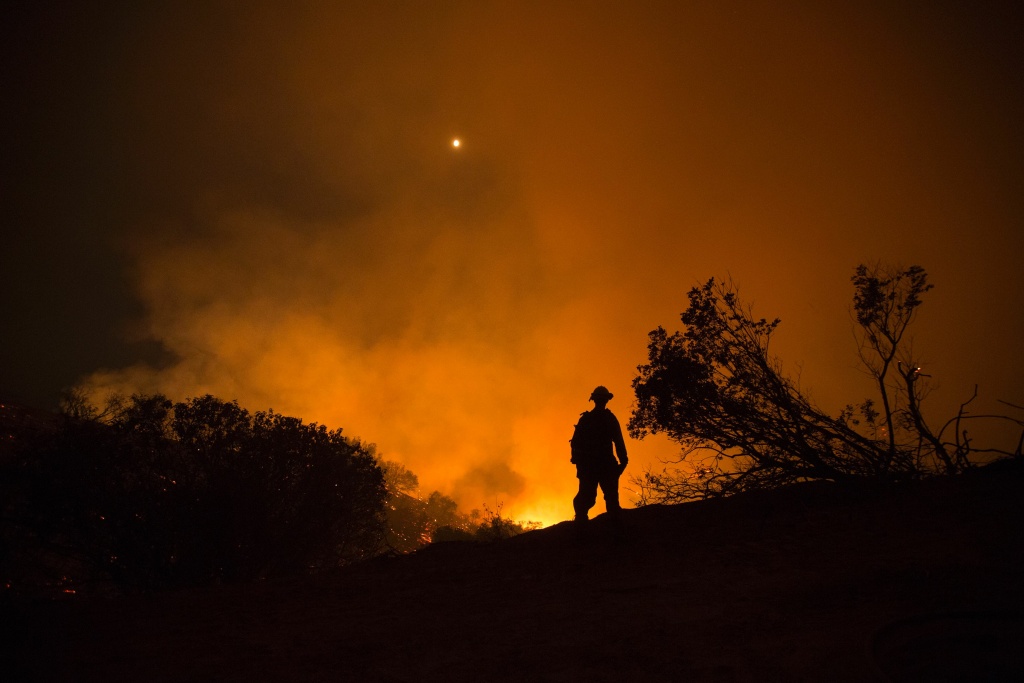 US-FIRE A firefighter looks over a flaming canyon, June 17, 2016 at the Sherpa Fire near Santa Barbara,California.
A fire in the Los Padres National Forest had expanded to two square miles (five square kilometers) by Thursday, making it the