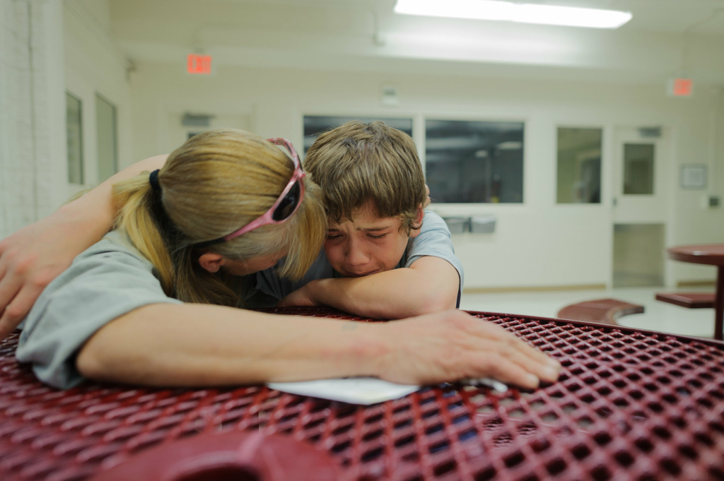 Instagram photographer Vinny, at age 13, cries during a visit with his mother, Eve, at the Bernalillo County Juvenile Detention Center in Albuquerque, New Mexico.