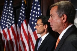 Speaker of the House John Boehner (R-OH) (R) and House Majority Leader Eric Cantor (R-VA) (L), listen to questions during a press conference following a meeting at the Republican National Committee offices July 26, 2011 in Washington, DC.