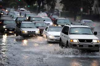 People drive their cars through deep water in Los Angeles on Dec. 22, 2010. Another storm has rolled in with gale warnings posted Dec. 29, 2010 along almost the entire California coast.