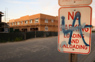 Graffiti is seen on a sign near a new townhouse construction site March 3, 2009 in Compton, California.