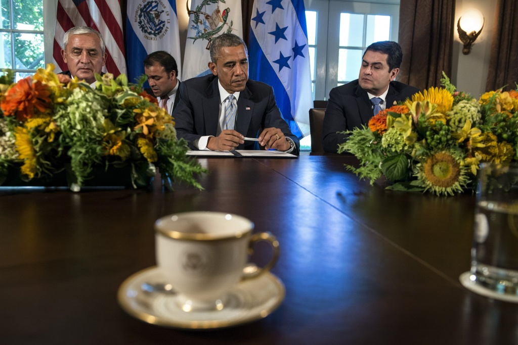 US-POLITICS-OBAMA From left, President of Guatemala Otto Perez Molina, US President Barack Obama and President of Honduras Juan Orlando Hernandez sit after a meeting in the Cabinet Room of the White House on July 25, 2014 in Washington to discuss the number of immigrants, specifically children, leaving the Central American region for other countries including the United States.