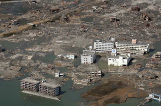 This aerial view taken on March 14, 2011 during an AFP-chartered flight shows an area destroyed by the tsunami in Minamisanriku, in Miyagi prefecture three days after a massive 8.9 magnitude earthquake and tsunami devastated the coast of eastern Japan.