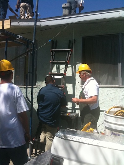 Alan Wlliamson, a solar installation trainer and expert with GRID Alternatives, brings young students from East Los Angeles to install PV panels on rooftops. He also brings his knowledge, and his tools.