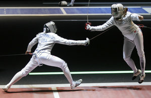 ap_111015118123_custom-860142ab169473d59c6e2c4c3178cb960873e23a-s300-c85.jpg Ibtihaj Muhammad (left) competes with Tunisia's Hela Besbes during a women's team sabre qualifying match at the 2011 World Fencing Championships in Catania, Italy.