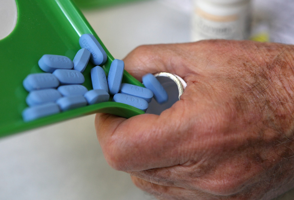 Daily Antiretroviral Pill Found To Protect Healthy From AIDS Transmission A pharmacist pours Truvada pills back into the bottle at Jack's Pharmacy on November 23, 2010 in San Anselmo, California. A study published by the New England Journal of Medicine showed that men who took the daily antiretroviral pill Truvada significantly reduced their risk of contracting HIV.