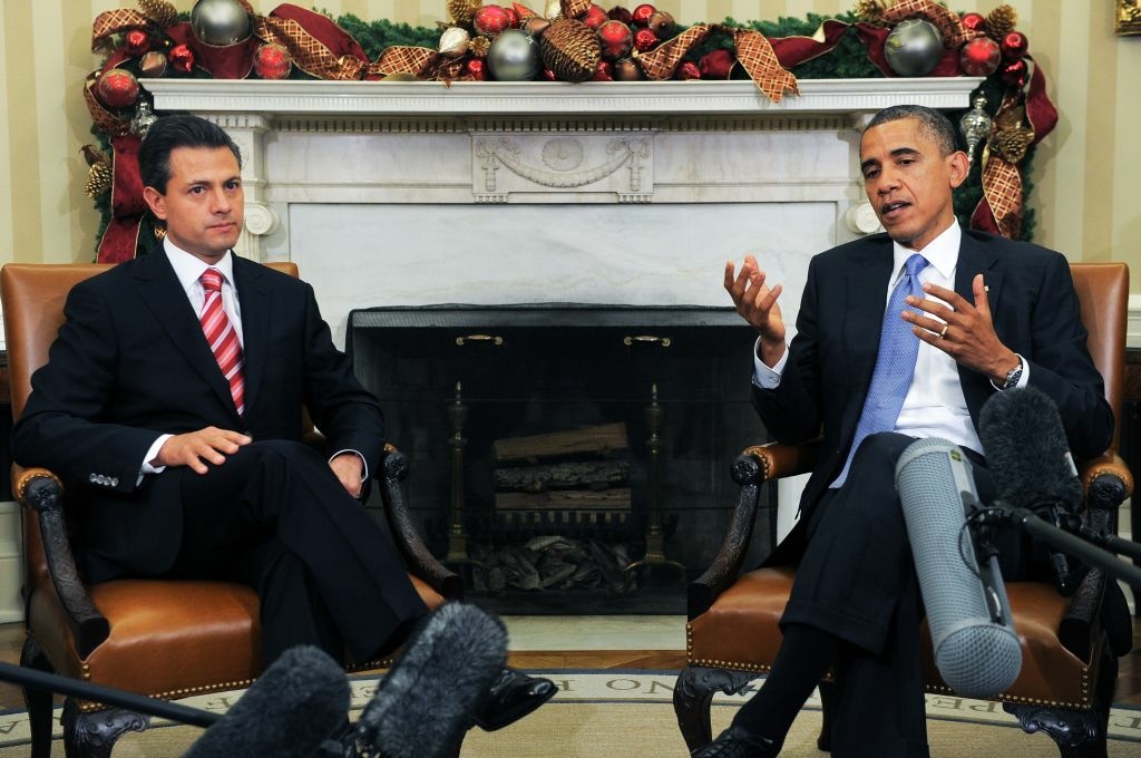 US-MEXICO-POLITICS-DIPLOMACY-OBAMA US President Barack Obama speaks tyo the press with President-elect Enrique Pena Nieto of Mexico during a bilateral meeting in the Oval Office at the White House in Washington on November 27, 2012. Pena Nieto, a member of the Institutional Revolutionary Party (PRI), takes office on December 1, replacing Felipe Calderon from the conservative National Action Party (PAN), five months after his election victory.