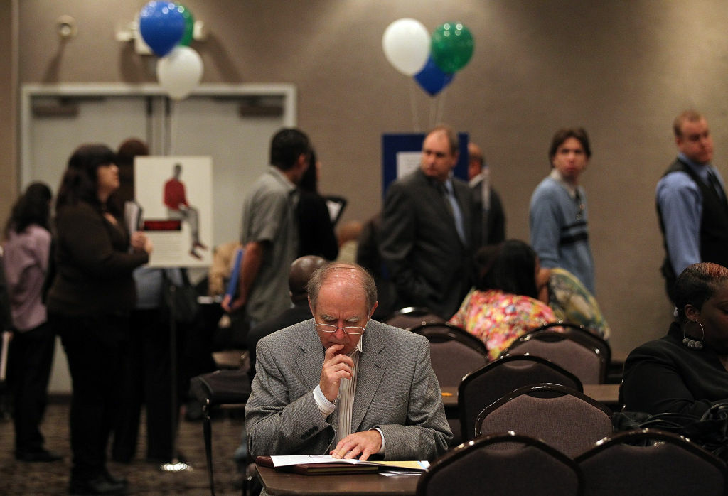 The U.S. Labor Department said Friday U.S. employers added 195,000 jobs in June and hiring was more robust in the two previous months than earlier estimated. The gains raise hopes for a stronger economy in the second half of 2013. (Photo: A job seeker pauses as he fills out an application during a job fair in Northern California).
.