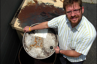 Mercer 7636 Providence chef and co-owner Michael Cimarusti shows off his restaurant's grease barrel... potential fuel for John's converted diesel car.