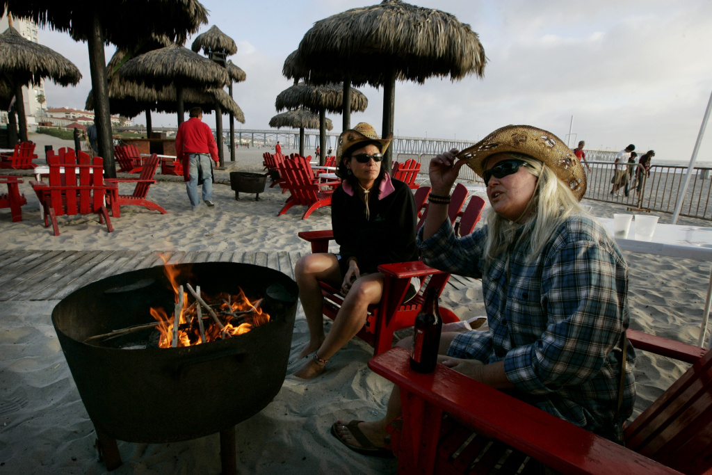 Drug War Dampens Spring Break Tourism In Mexico Carol Arthur (R) and Tammy Delu, from Seattle, sit at a bar along the beach April 1, 2009 in Rosarito, Mexico. The tourist industry in some northern Mexican resort towns is feeling the effects of the ongoing drug war, as students from the U.S. are curtailing their spring break plans and traveling domestically instead.