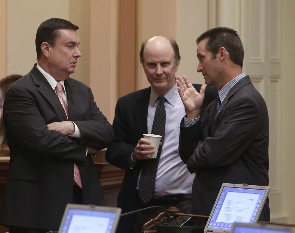 Republican state Senators, Joel Anderson of Alpine, left, Mark Wyland of Escondido, center, and Steve Knight of Palmdale confer as the Senate debated a bill regarding transgender students, at the Capitol in Sacramento, Calif., Wednesday, July 3, 2013. By a 21-9 vote the Senate approved AB1266, by Assemblyman Tom Ammiano, D-San Francisco, that would require public K-12 schools let transgender students choose which restrooms they use and which school teams they join based on their gender identity. Anderson, Wyland and Knight voted against the measure.