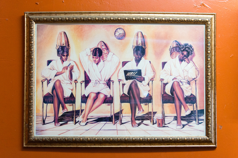 Art hangs in the barbershop. Art hangs in the barbershop.