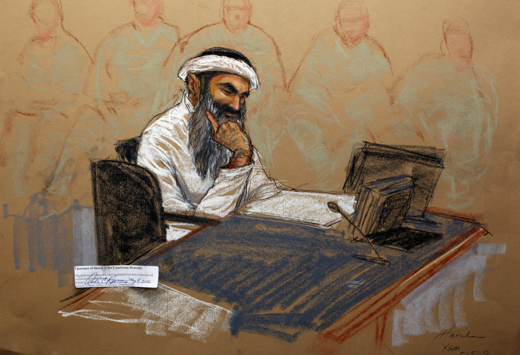 In this courtroom drawing reviewed and a In this courtroom drawing reviewed and approved for release by a US military security official, Khalid Sheikh Mohammed sits in court on May 5, 2012 at the US Naval Base in Guantanamo Bay, Cuba.