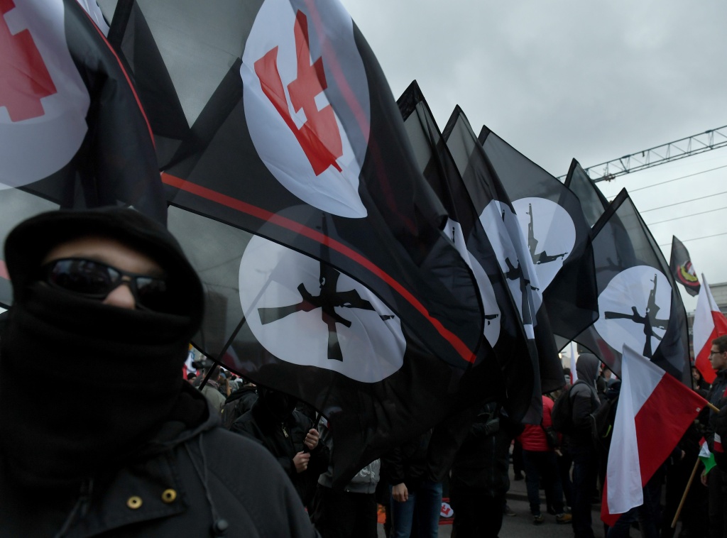POLAND-INDEPENDENCE-DEMO Demonstrators burn flares and wave Polish flags during the annual march to commemorate Poland's National Independence Day in Warsaw on November 11, 2017.
Poland's National Independence Day commemorates the anniversary of the Restoration of a Polish State in 1918. / AFP PHOTO / JANEK SKARZYNSKI (Photo credit should read JANEK SKARZYNSKI/AFP/Getty Images)