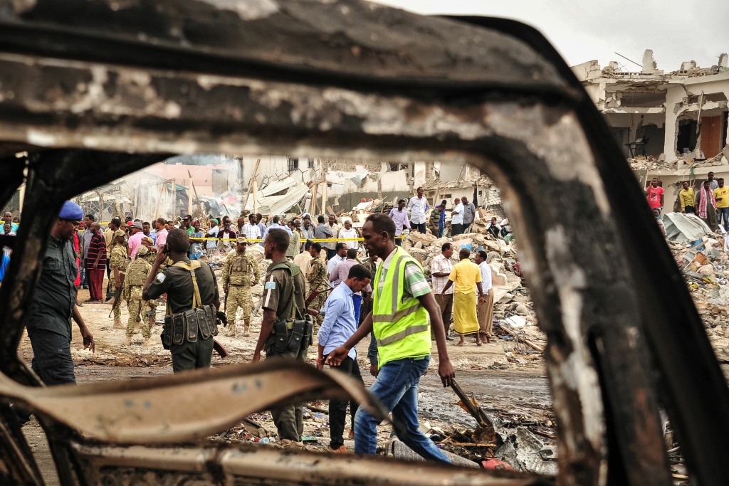 SOMALIA-BOMBING-CONFLICT Somali soldiers patrol the scene where a truck bomb exploded in the center of Mogadishu on October 15, 2017.